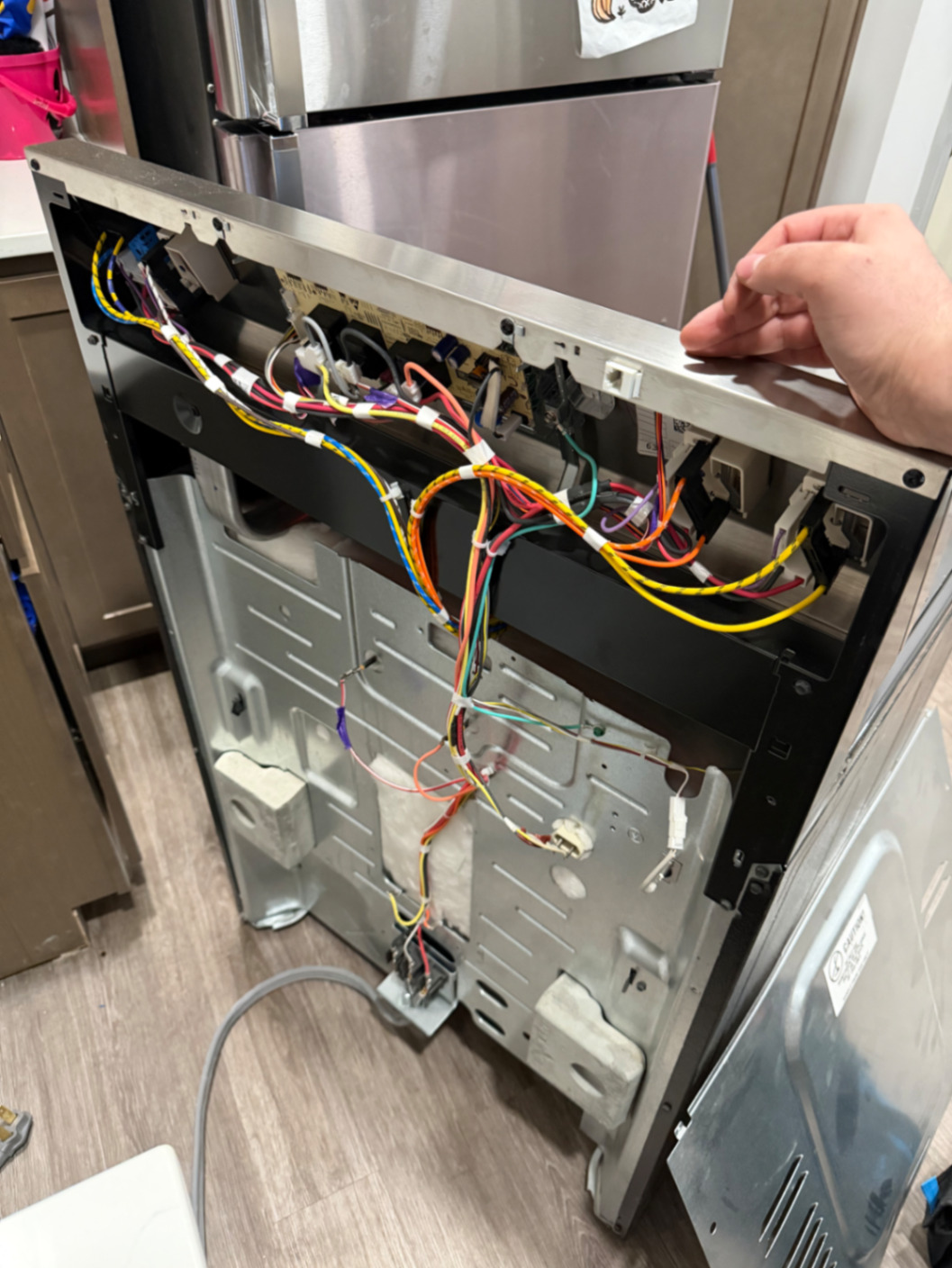 Stove control panel removed for wiring and board repair