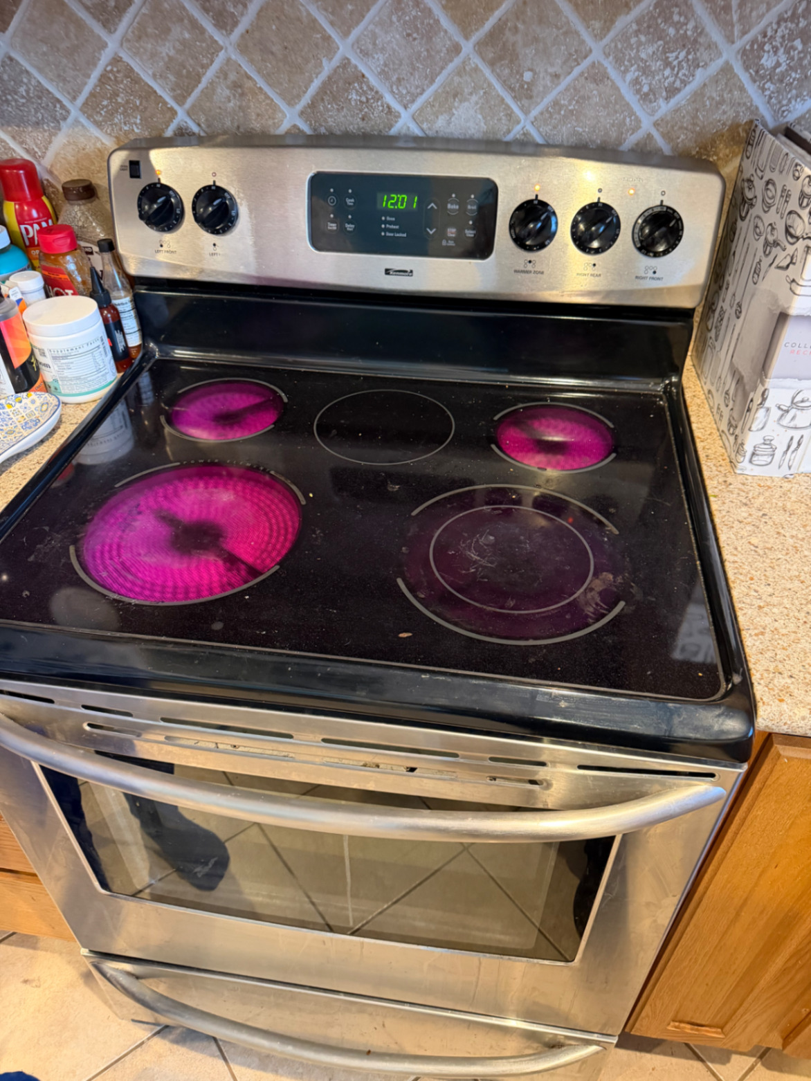 Electric stove cooktop with radiant burners heating during diagnosis