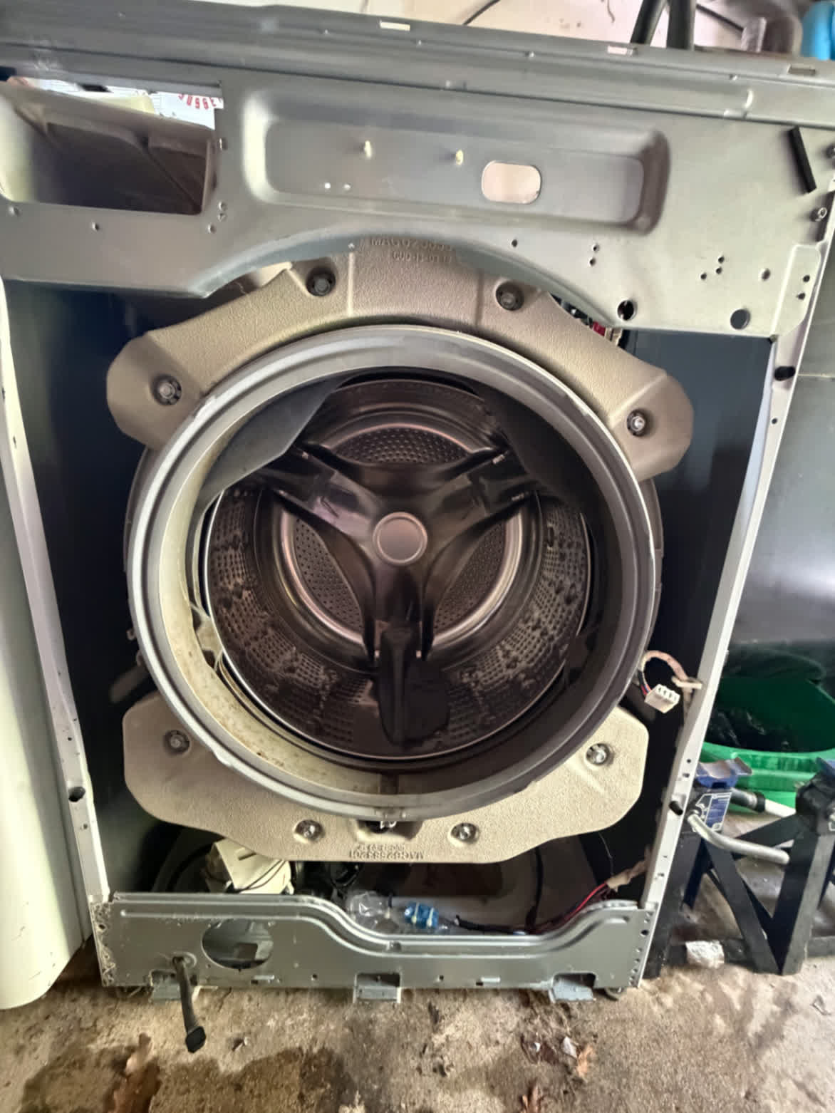 Front-load washer tub assembly exposed during in-home repair