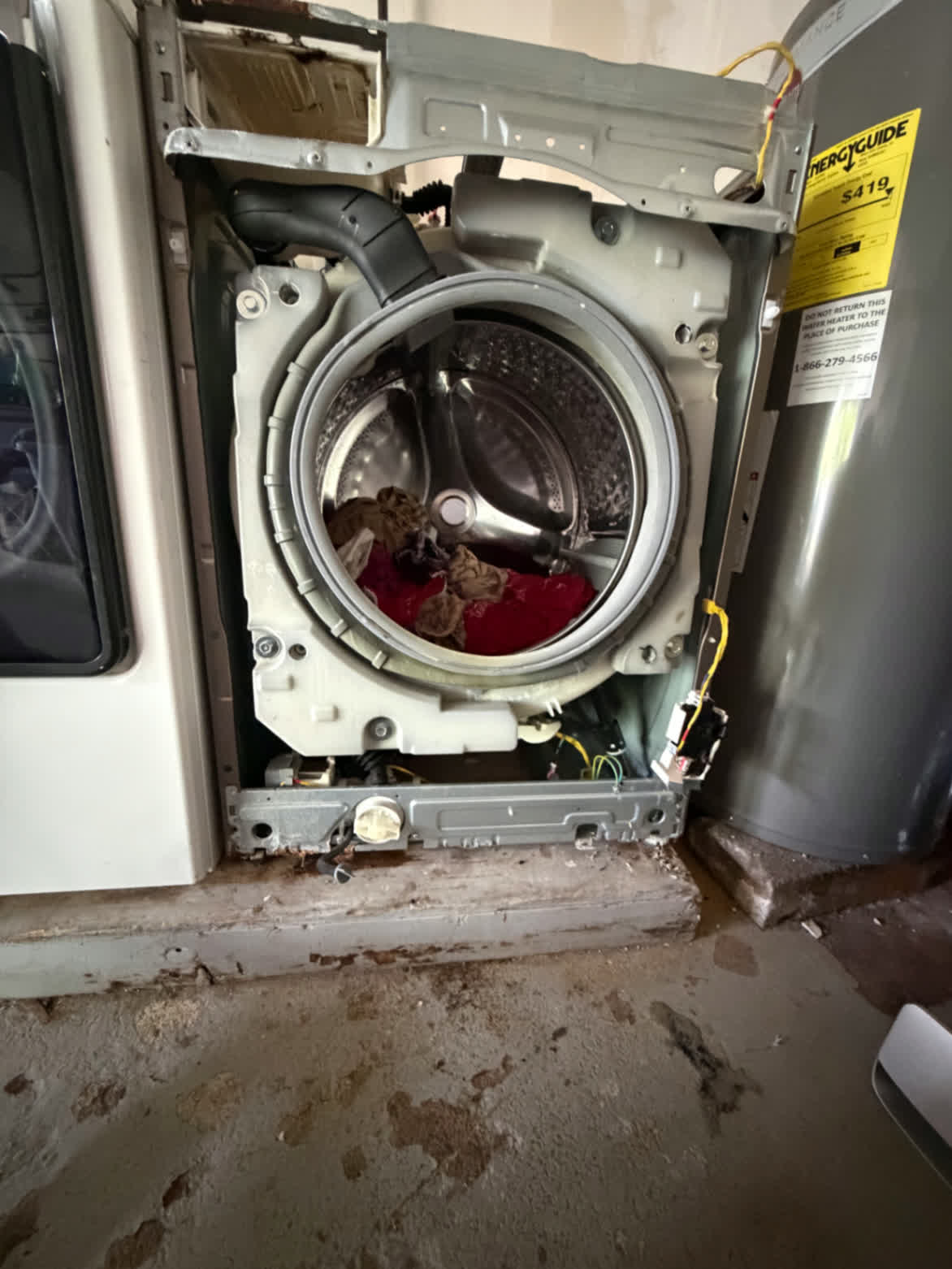 Front-load washer opened for full teardown and leak diagnosis