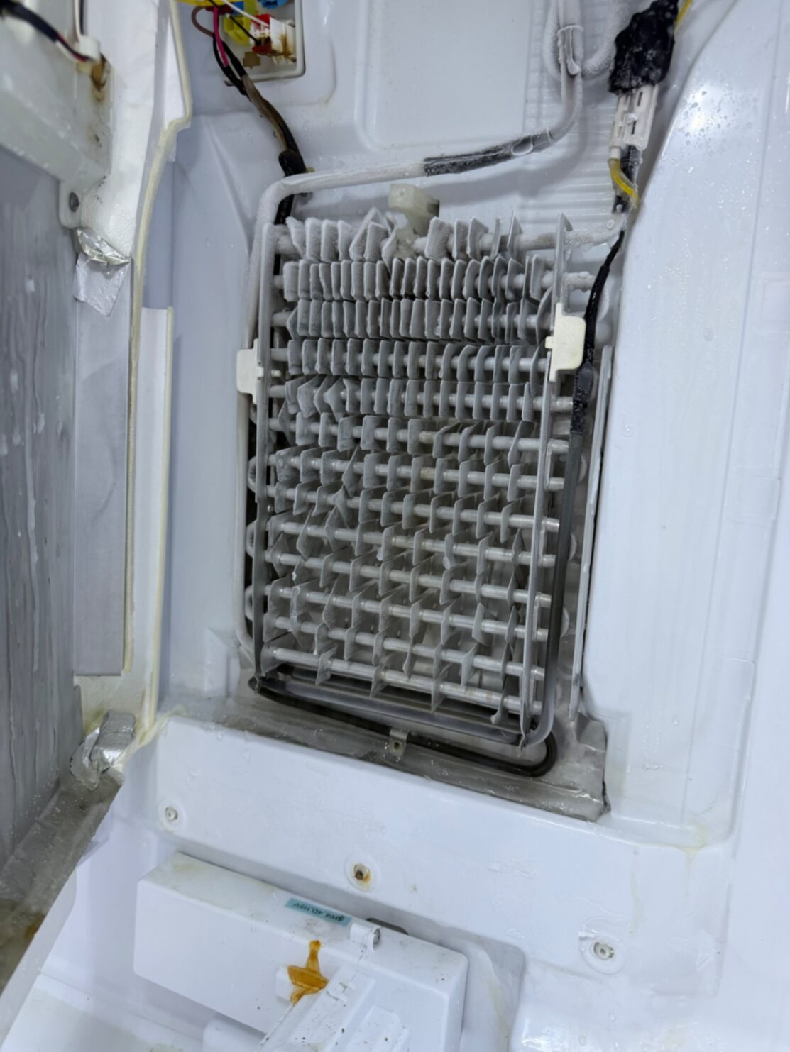 Refrigerator evaporator coil inspection during in-home repair
