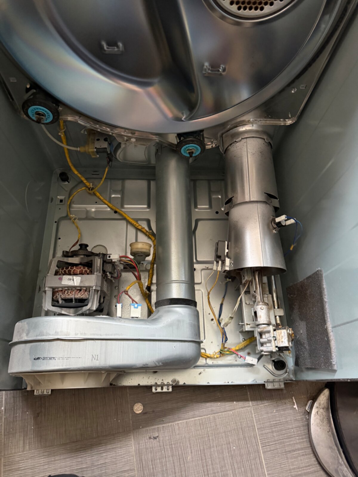 Dryer interior showing motor, blower housing, and heating assembly
