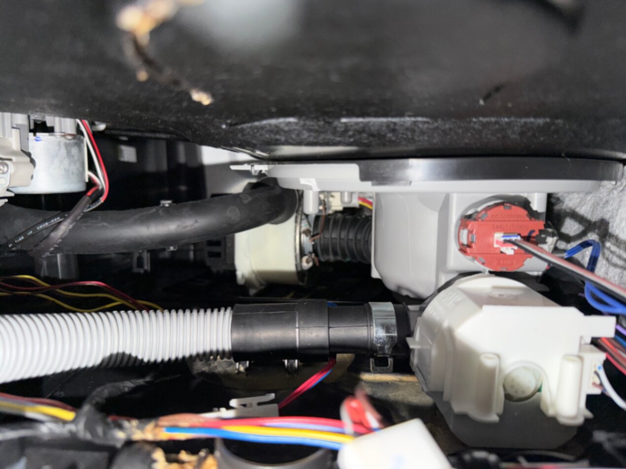 Dishwasher pump and hose assembly during on-site repair